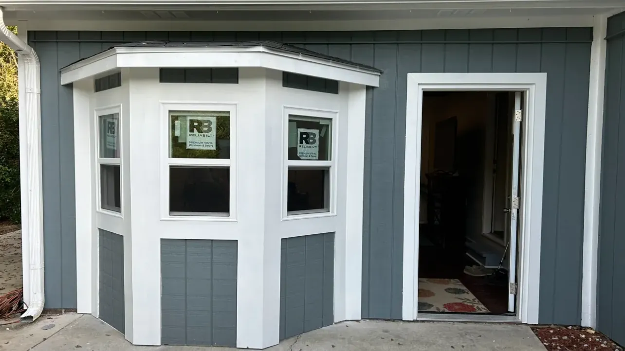 Exterior trim, siding and a bay window after repair by The handyman in Griffin, GA
