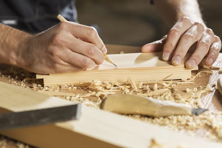 Cutting replacement timber during a water damage repair